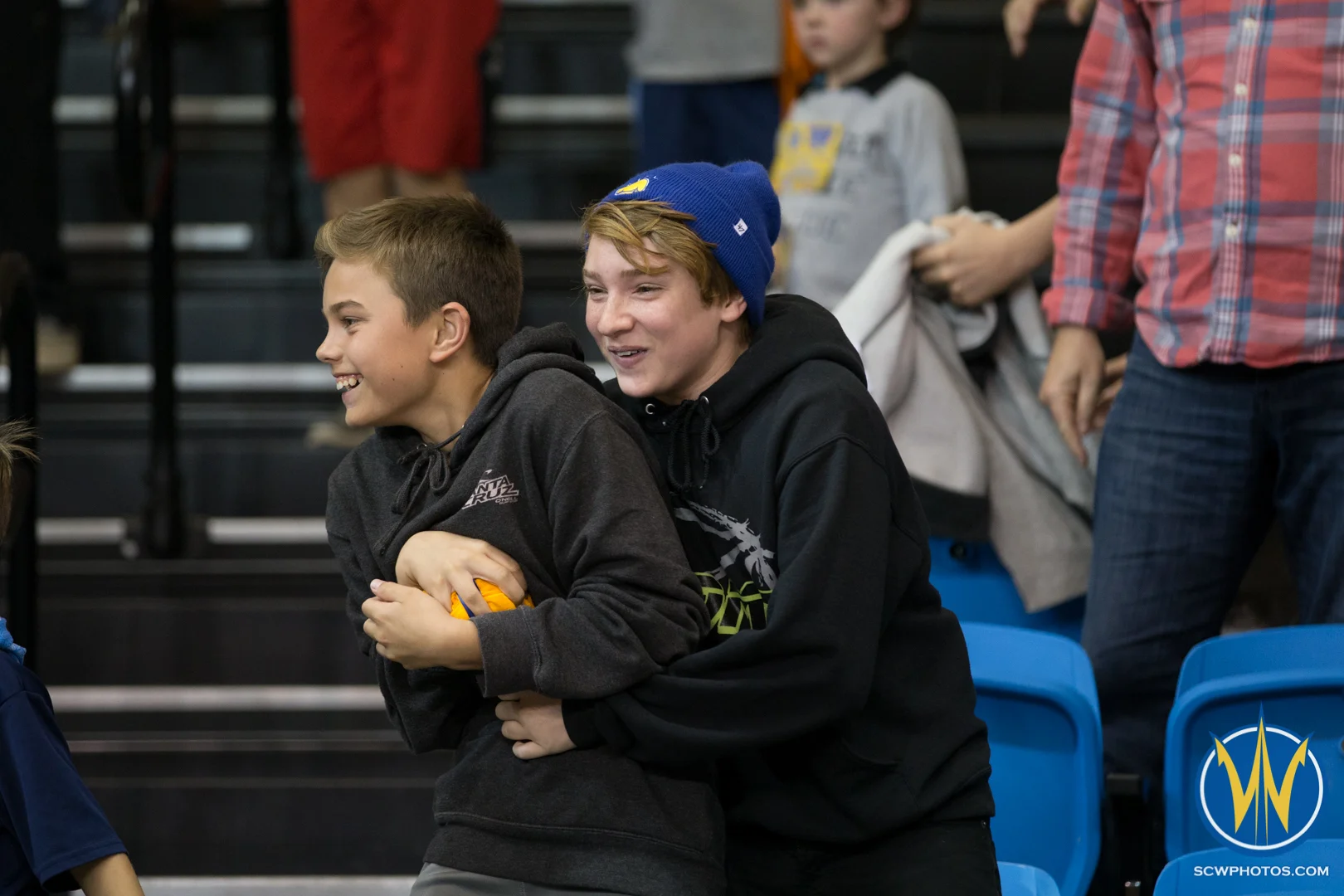Two young fans tussle over a t-shirt at Kaiser Permanente Arena on February 19, 2016 (Photo: Ariel Nava Photography)
