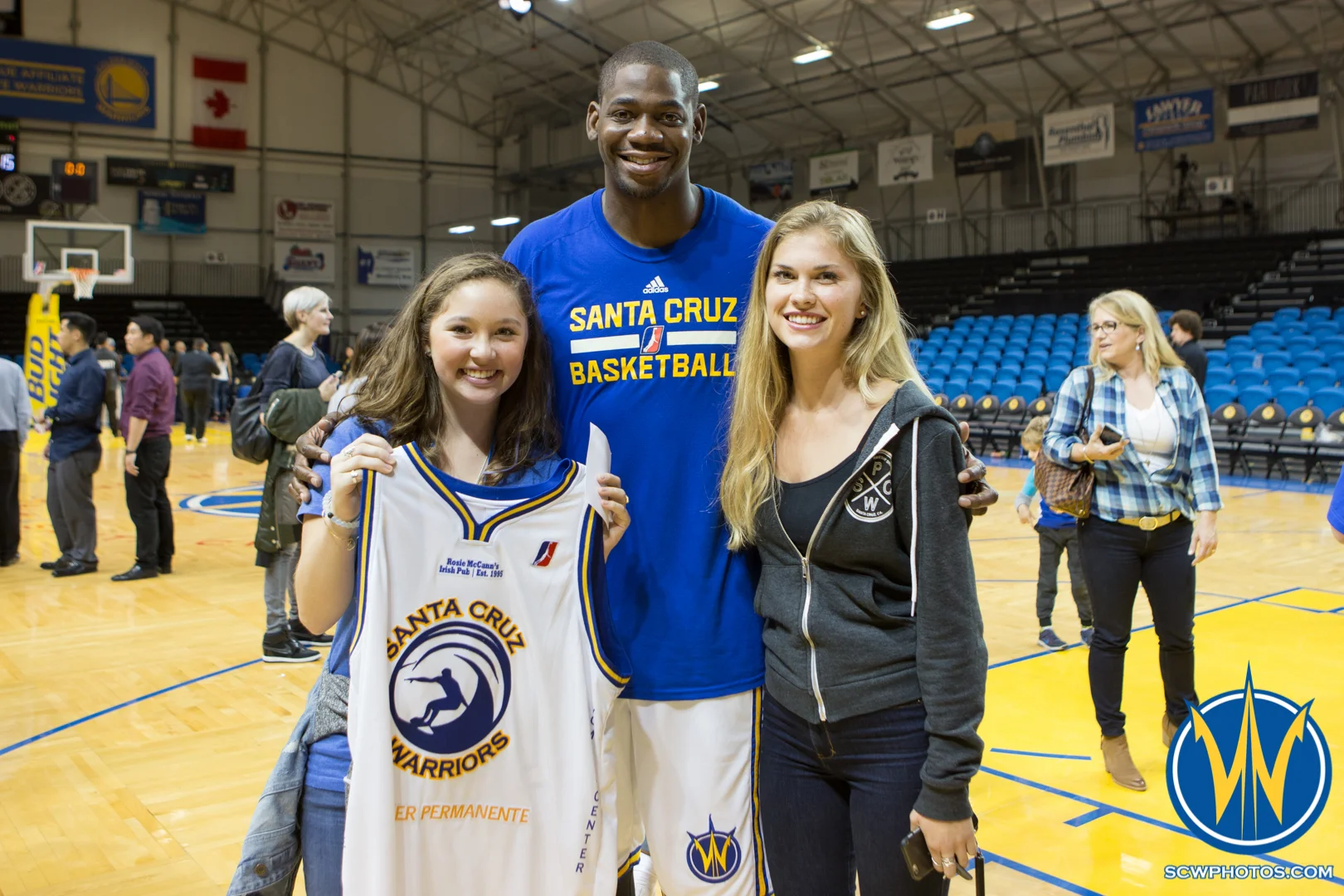Ronnie Brewer poses with winners of his jersey that was auctioned off during the game at Kaiser Permanente Arena on February 26, 2016 (Photo: Ariel Nava Photography)