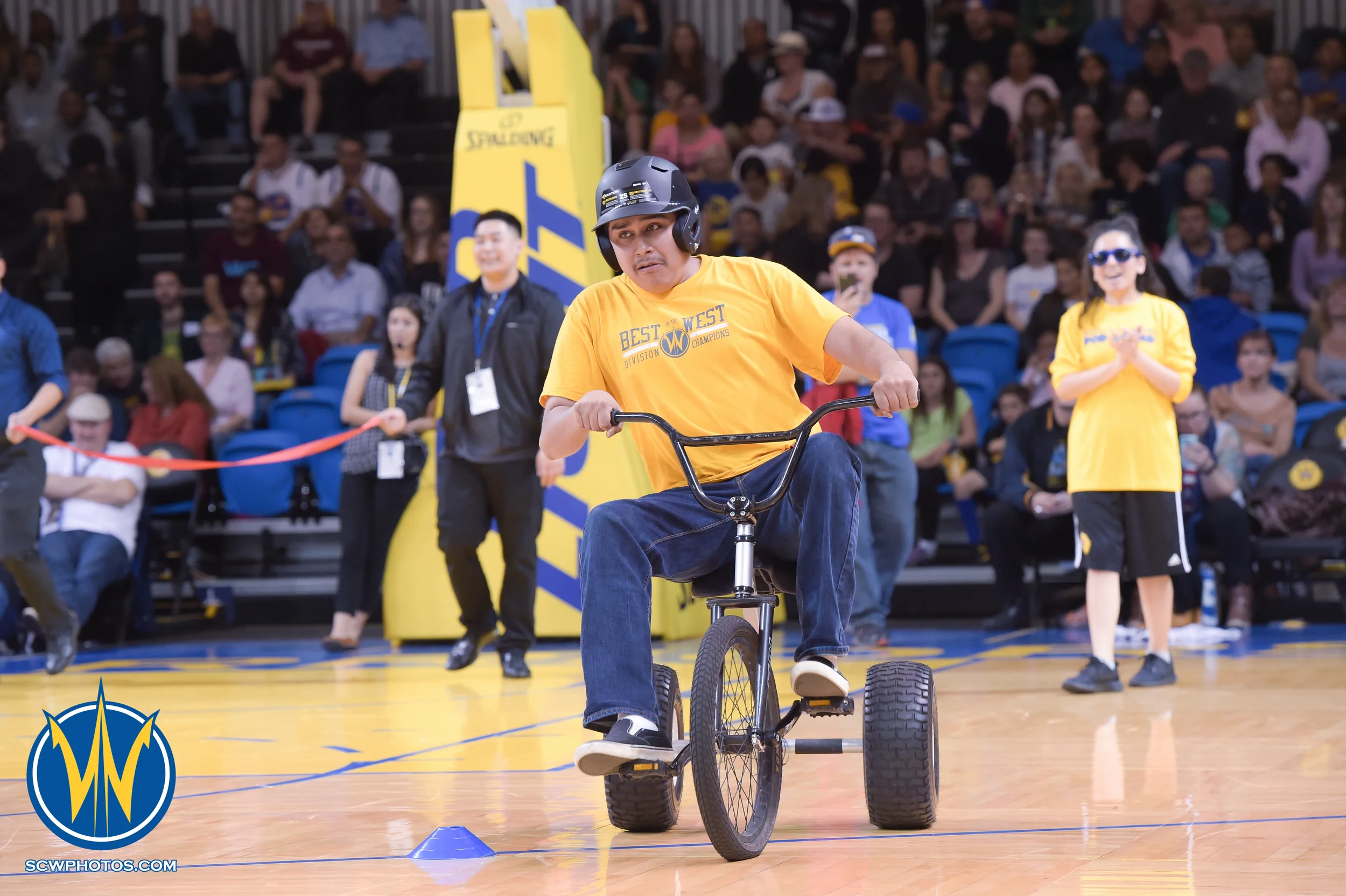 Warrior fan participates in the Tricycle Race during a timeout the Santa Cruz Warriors vs Bakersfield Jam game on 3/2/16 at Kaiser Permanente Arena in Santa Cruz, California. (Photo: (Phil Pasag Photography) /SC Warriors 2016)