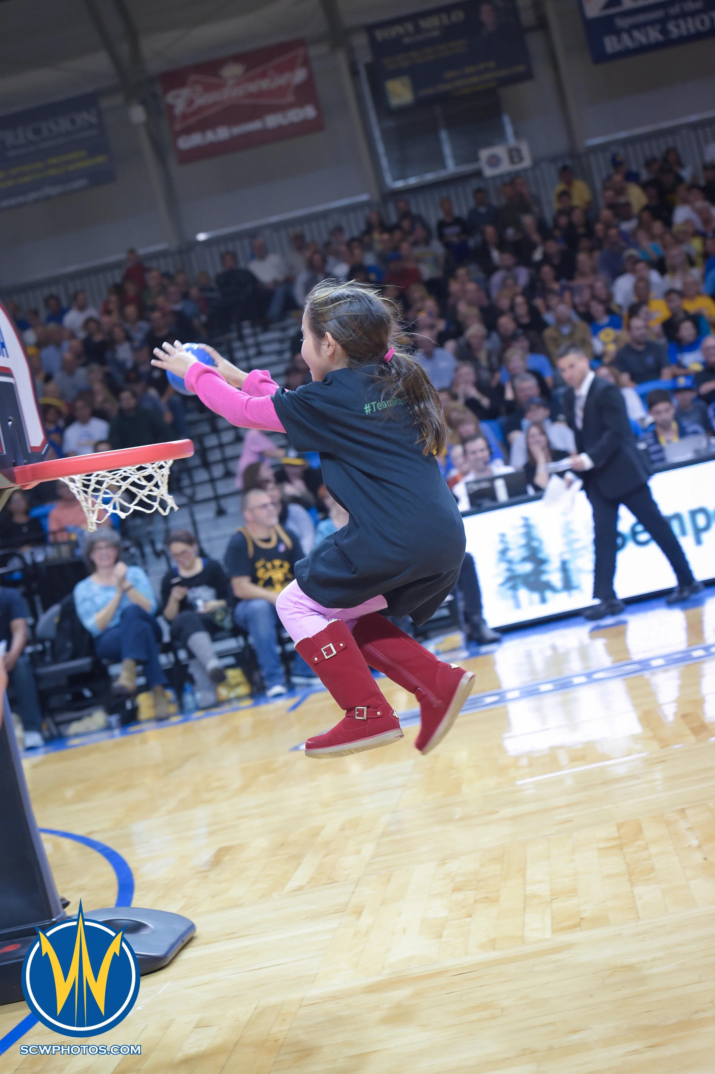 Young Warrior fans shows his slam dunk skills in a promotional game during a timeout at the Santa Cruz Warriors vs Bakersfield Jam game on 3/2/16 at Kaiser Permanente Arena in Santa Cruz, California. (Photo: (Phil Pasag Photography) /SC Warriors 2016)
