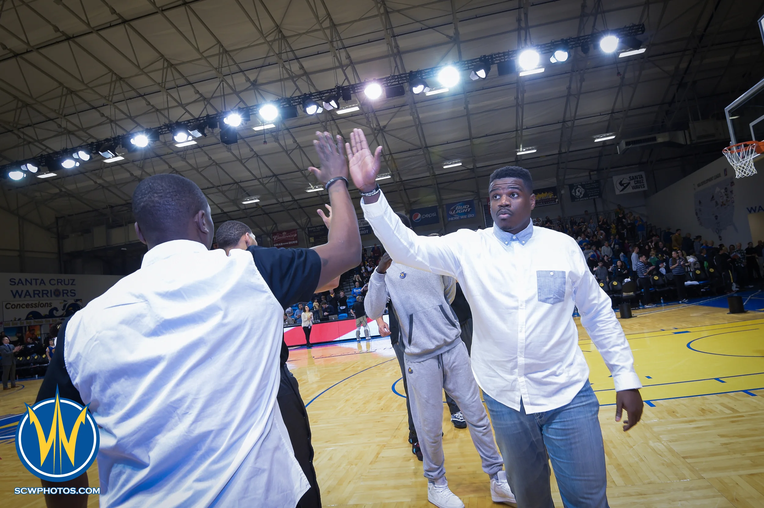 Warriors high five after the National Anthem at the Santa Cruz Warriors vs Delaware 87ers on 3/13/16 at Kaiser Permanente Arena in Santa Cruz, California. (Photo: (Phil Pasag Photography) /SC Warriors 2016)