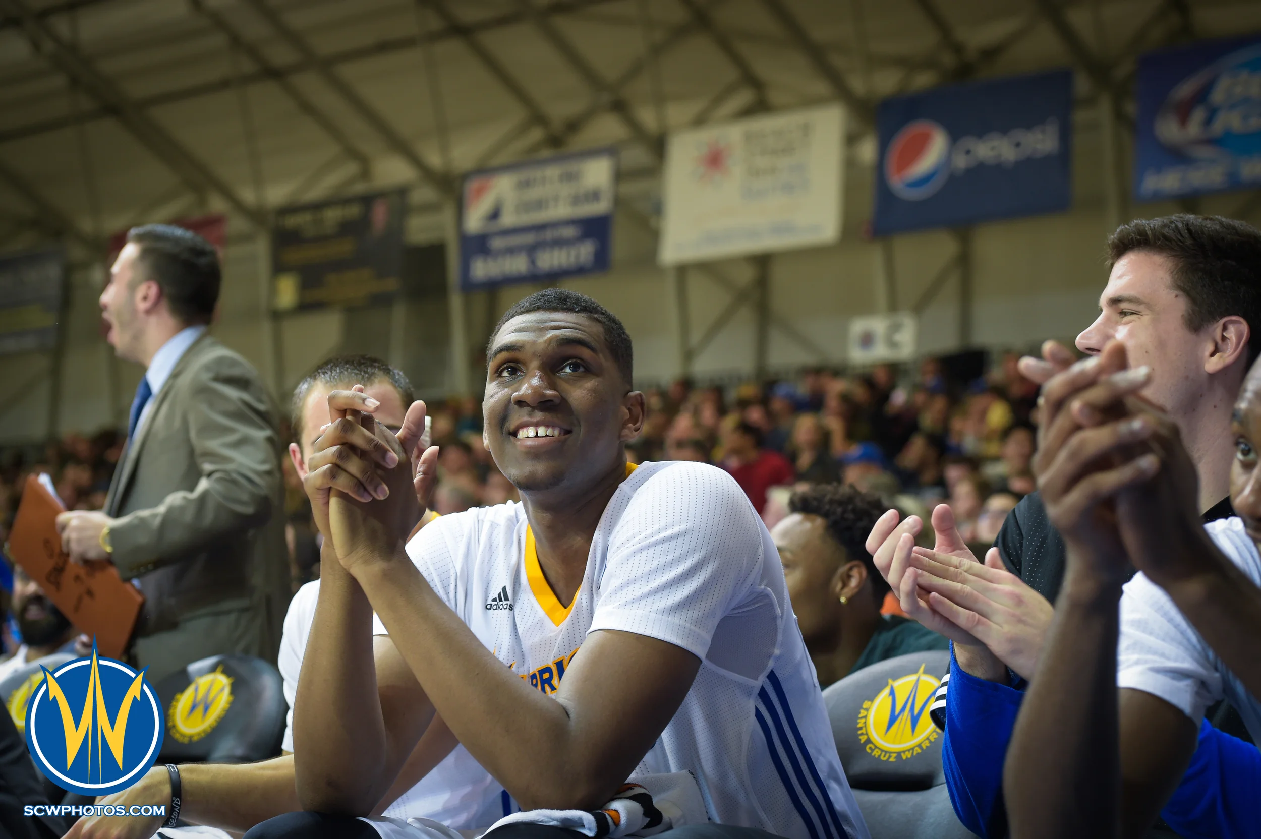 Kevon Looney sharing some laughs at the Santa Cruz Warriors vs Delaware 87ers on 3/13/16 at Kaiser Permanente Arena in Santa Cruz, California. (Photo: (Phil Pasag Photography) /SC Warriors 2016)