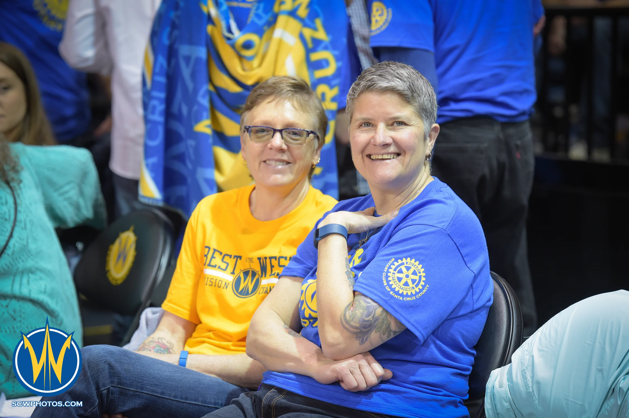 Warrior fans smiling for the camera at the Santa Cruz Warriors vs Delaware 87ers on 3/13/16 at Kaiser Permanente Arena in Santa Cruz, California. (Photo: (Phil Pasag Photography) /SC Warriors 2016)
