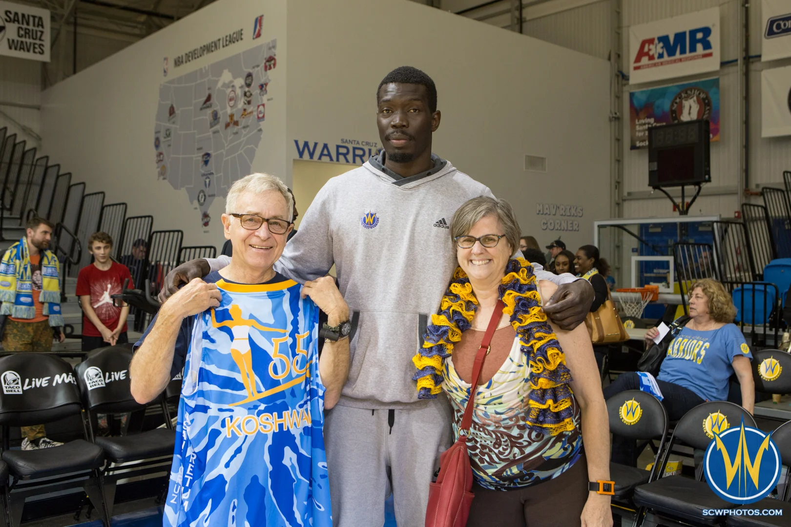 Mac Koshwal poses with the winners of his auctioned jersey at Kaiser Permanente Arena on March 24, 2016 (Photo: Ariel Nava Photography)