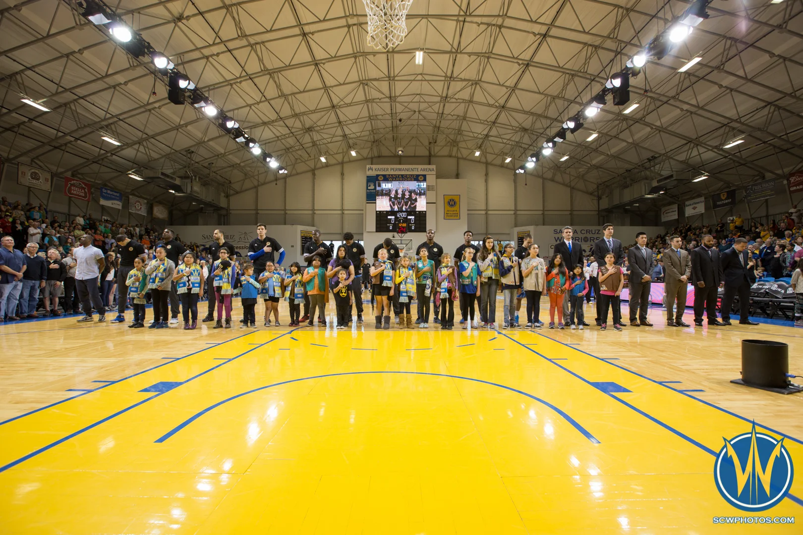 Fans stand with players and the coaching staff for the National Anthem at Kaiser Permanente Arena on March 24, 2016 (Photo: Ariel Nava Photography)