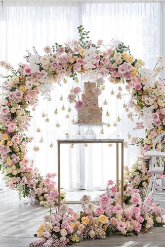 wedding-trends-2019-elegant-cake-table-with-hanging-pare-pink-white-orchid-flower-arch-georgejohnphotography-334x500.jpg