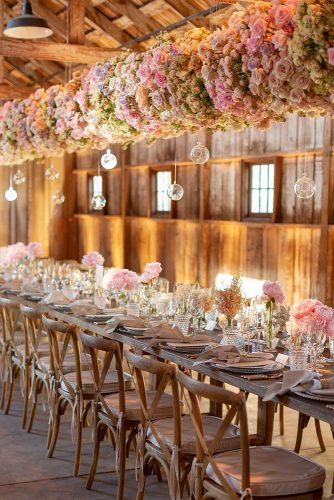 wedding-trends-2019-long-table-in-barn-with-suspended-flowers-and-glass-decor-eddiezaratsian-334x500.jpg