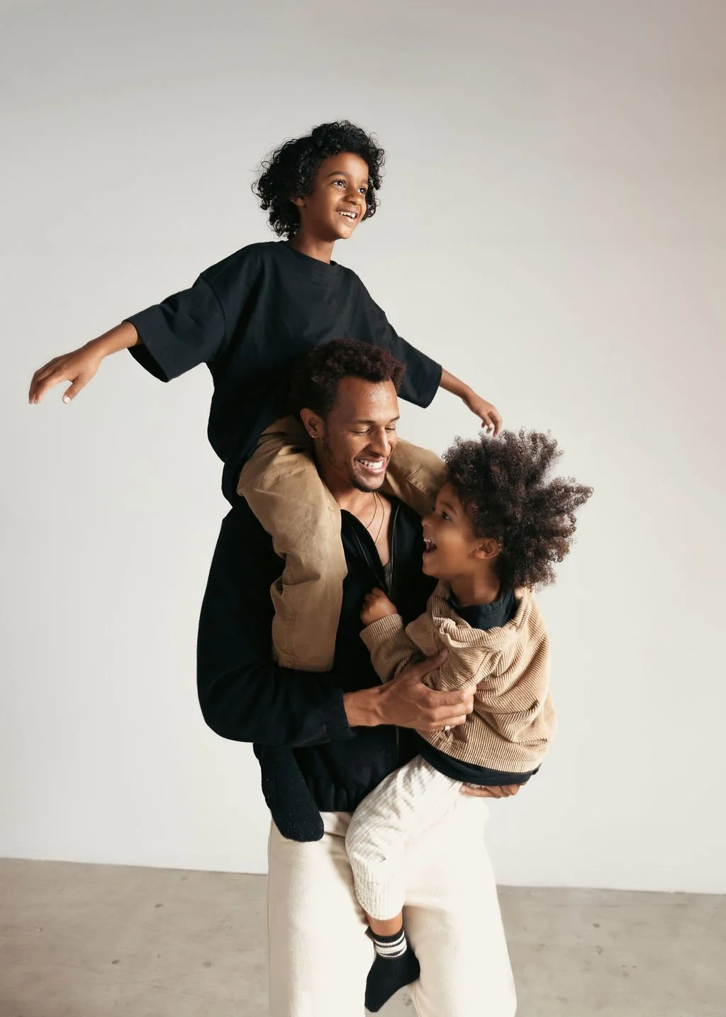 Fun candid family photographer in Los Angeles in studio, family photography 