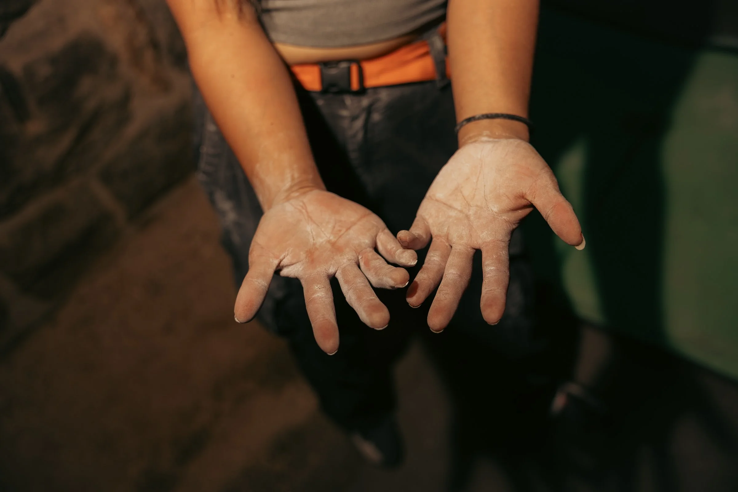 Rock climber chalky hands