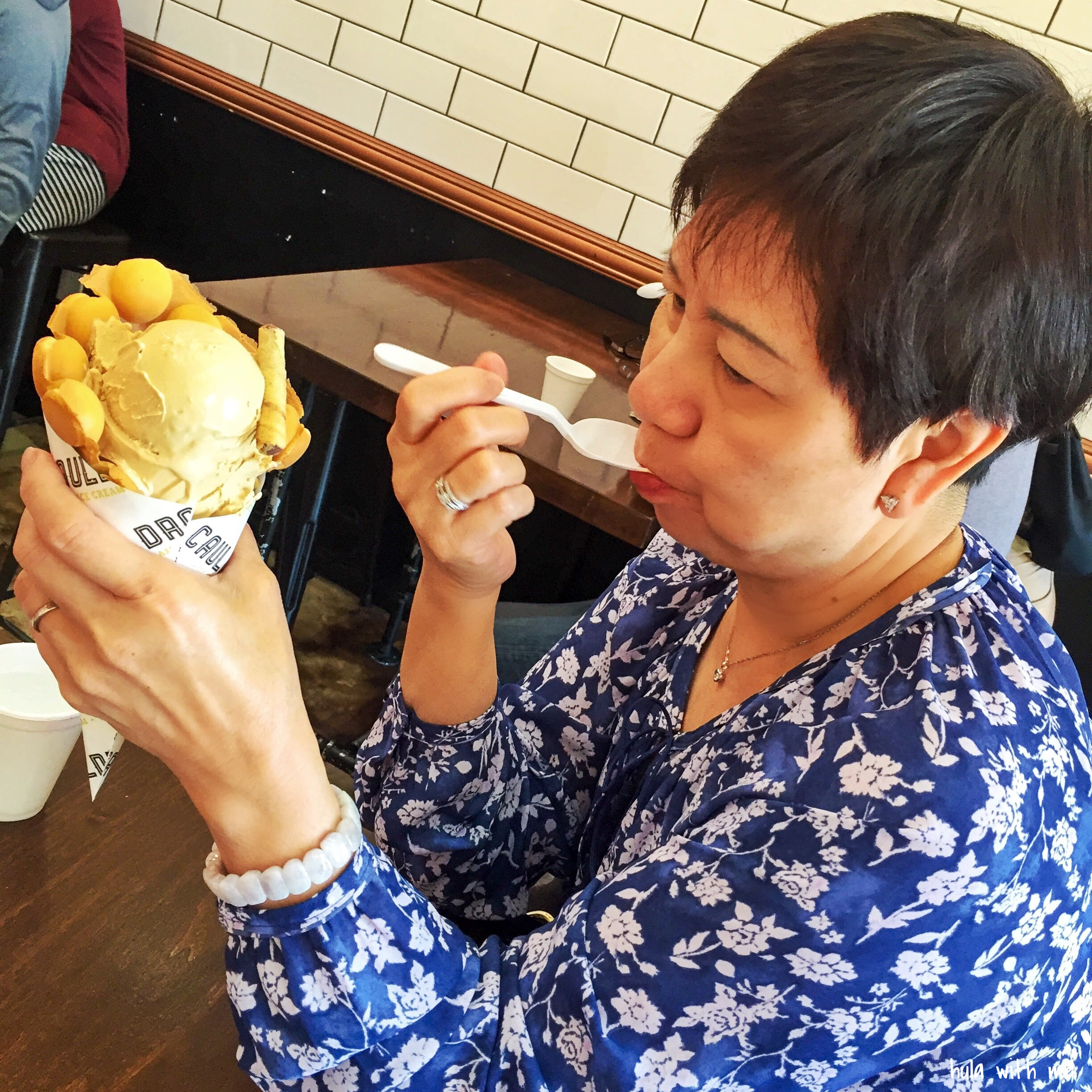 Enjoying Puffle Ice Cream prepared with liquid nitrogen at Cauldron Ice Cream in Orange County, CA