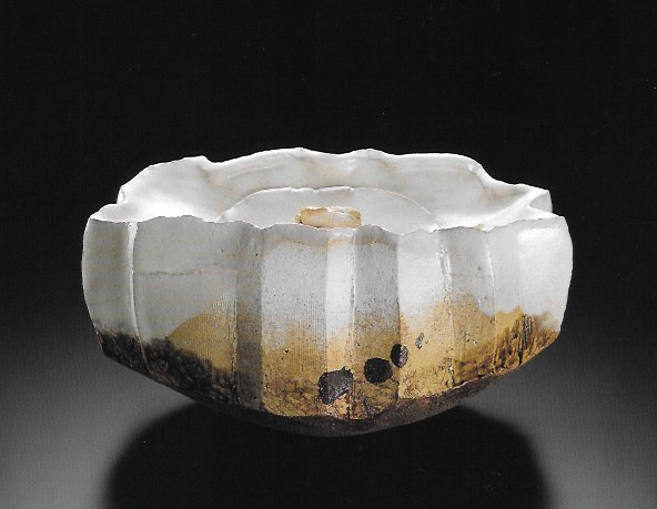 Ash glazed tea ceremony jar, decorated with a bit of glaze paint for decoration.