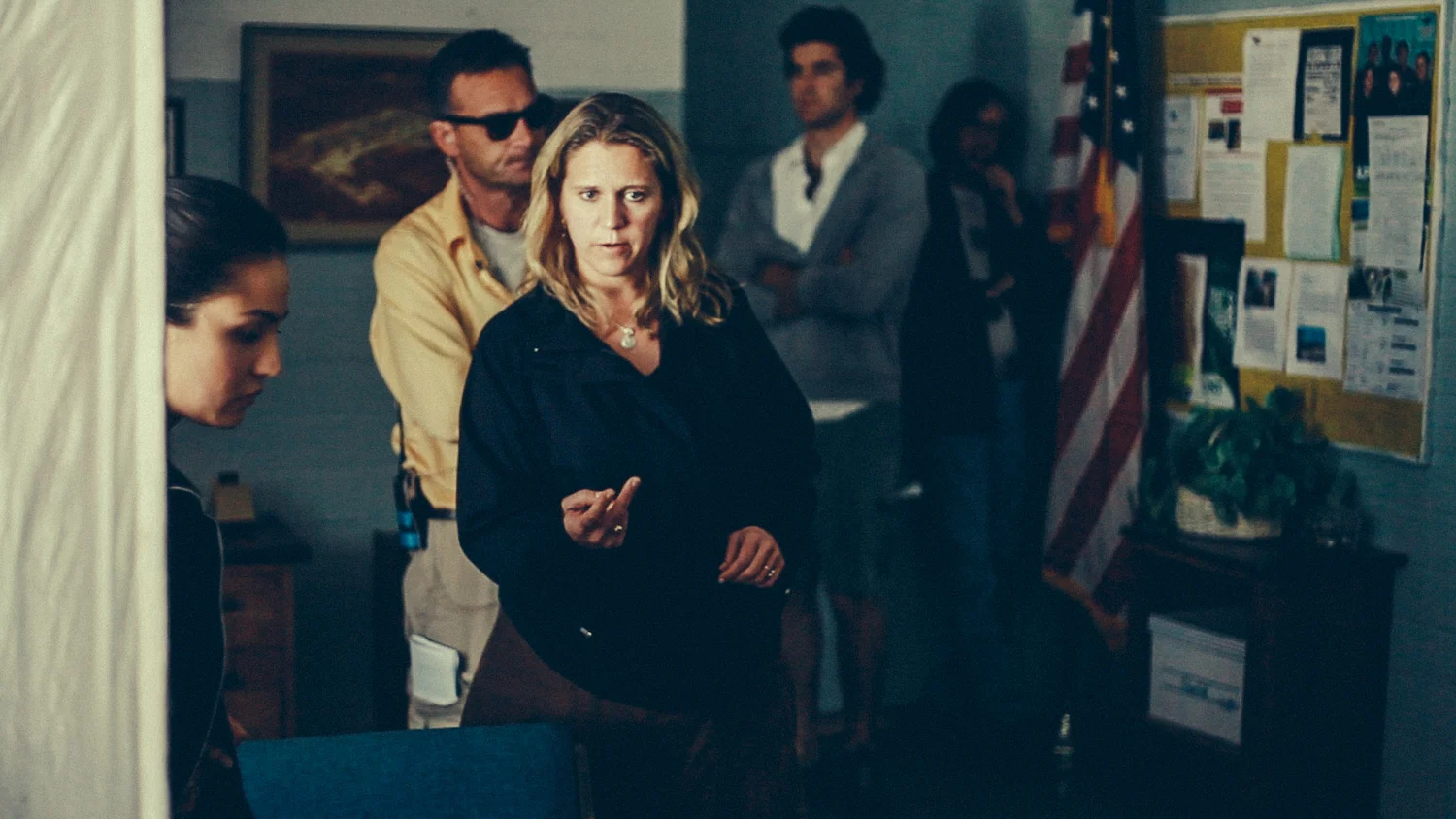 Amy Wendel (director) discussing the scene and setting up the shot with her cast and crew.