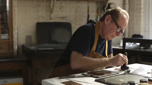 Michael Phillips Inking the relief-etched copper plae using a leather-covered dauber.jpg