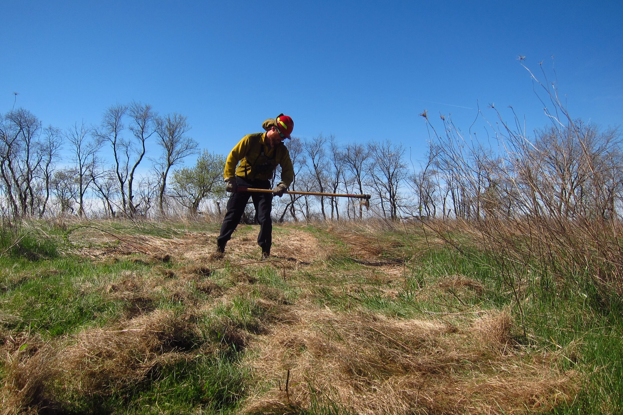  As needed, crew members install and improve firebreaks, and prep around objects needing protection from fire and heat. 