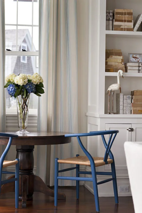 In a more traditional setting in blue from Interior designer Elizabeth Bolgnino