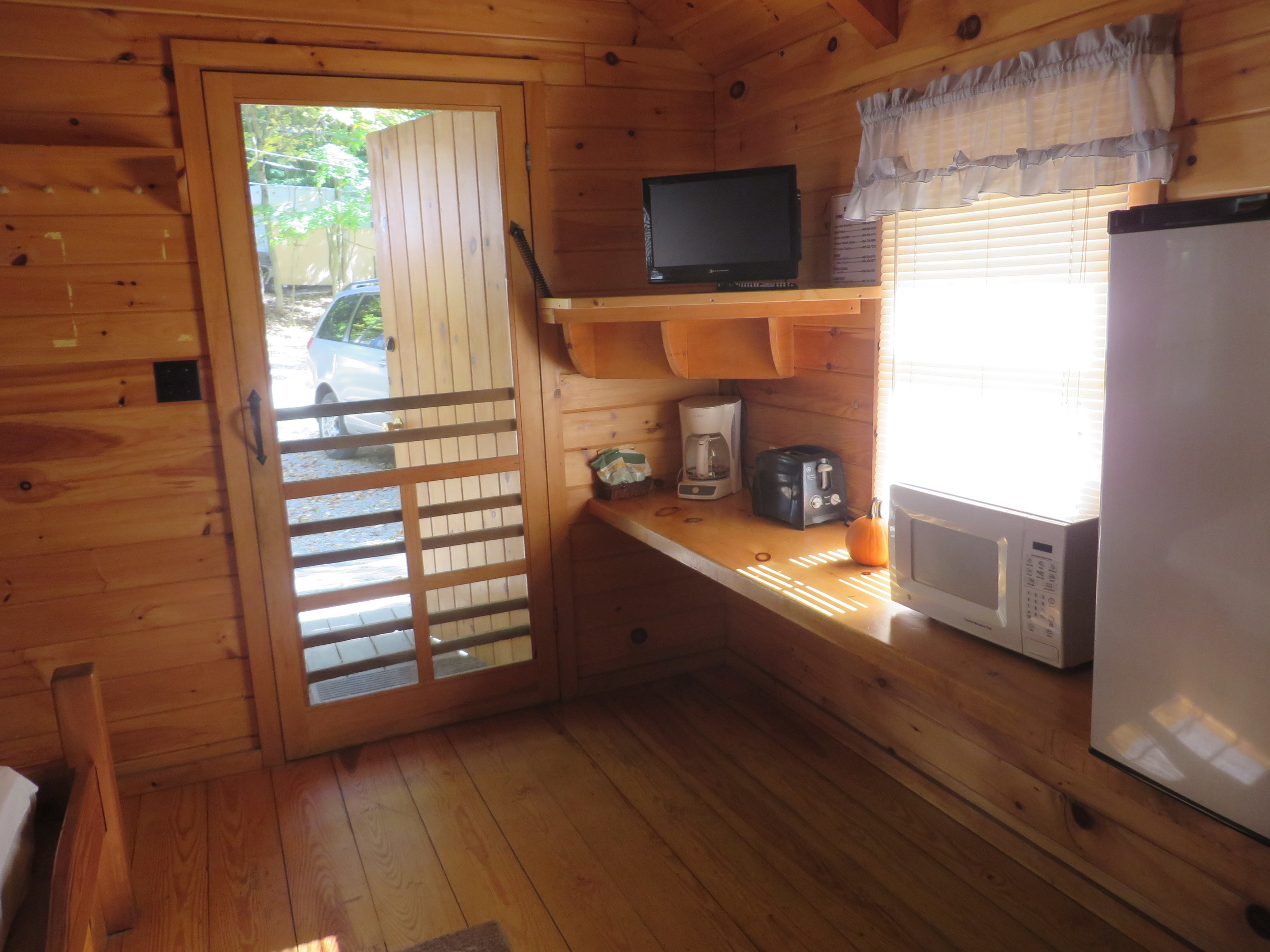 front door and kitchenette in cabin