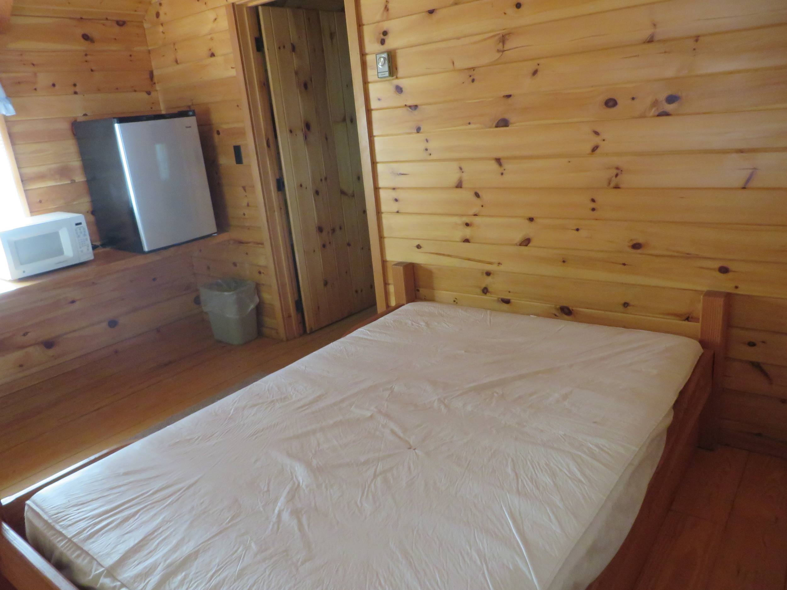 master bed and kitchenette in cabin