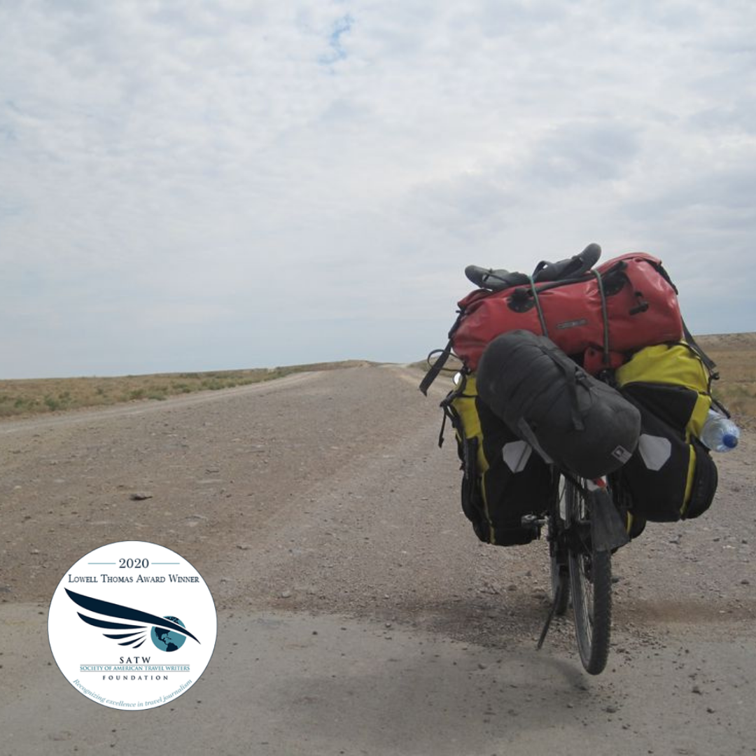 Touring bike loaded with baggage in the middle of the desert in Kazakhstan