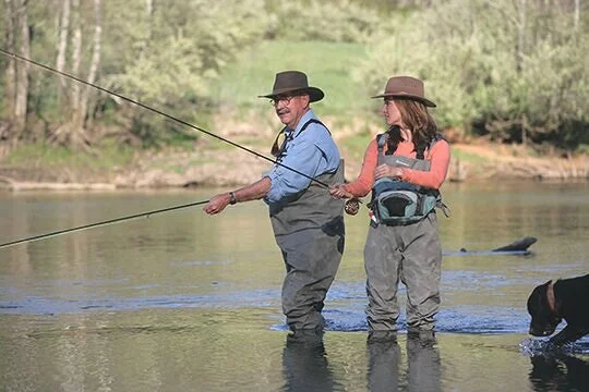 Author Kim Cross fly-fishing with her father in the Clinch River in Tennessee