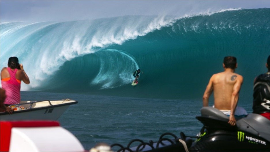 Big wave surver Keala Kennelly shredding a wave