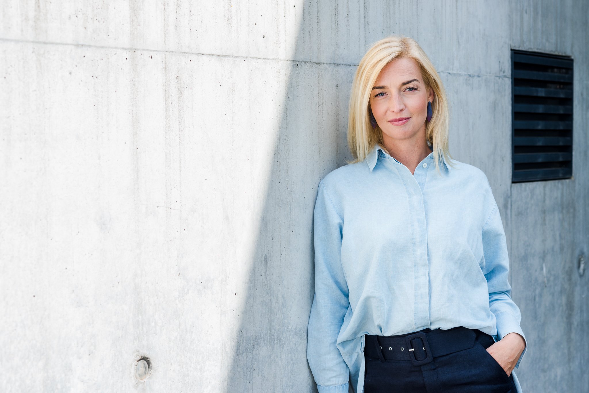 minimal portrait of a young woman in smart casual clothes