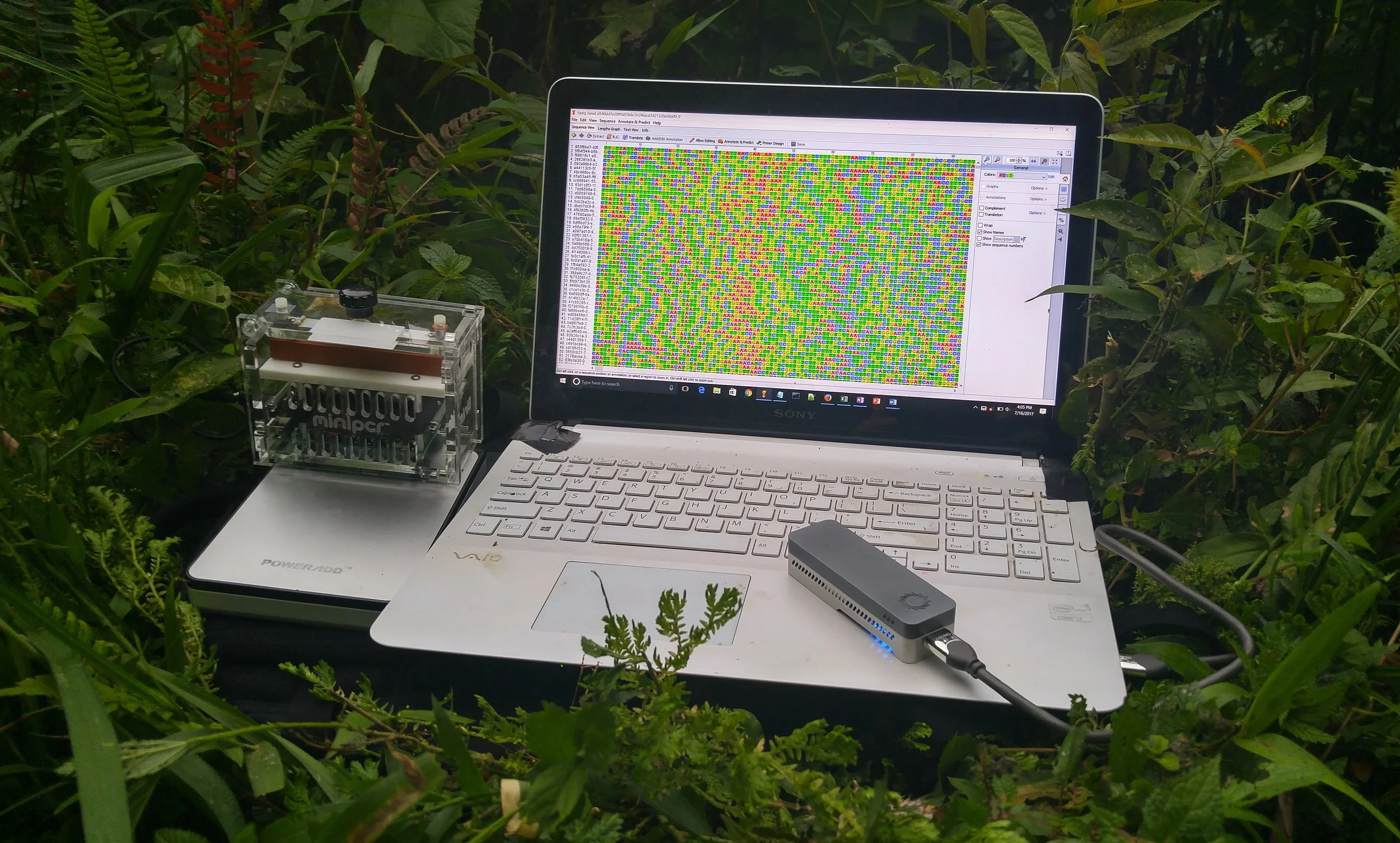 Components of the portable lab used on the trip. Left to right: miniPCR sitting atop the Poweradd battery, Vaio laptop with Geneious pro software to visualize sequence data, and the ONT MinION sequencer powered by the laptop.