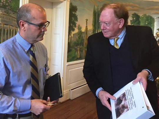 Clant Seay, a Tennessee walking horse anti-soring activist, presents a 6,000-signature petition to Tom Womack, the Tennessee Department of Agriculture deputy commissioner, on Dec. 8, 2016.