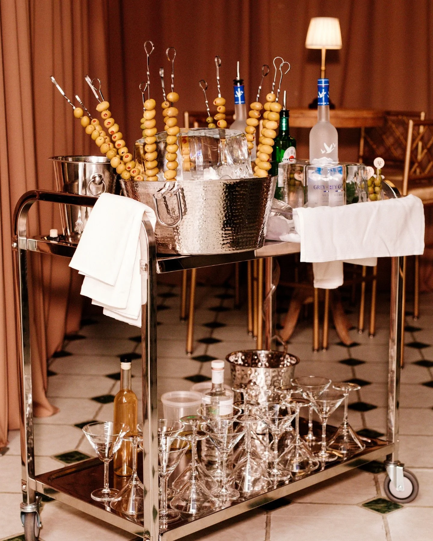 A milestone celebration deserves memorable moments.

Cocktail hour opened with off with AF-branded staff serving signature sips, while a martini cart and tequila shots kept spirits high. A sculptural grazing table by @cateringbyalo and a live flamb&e
