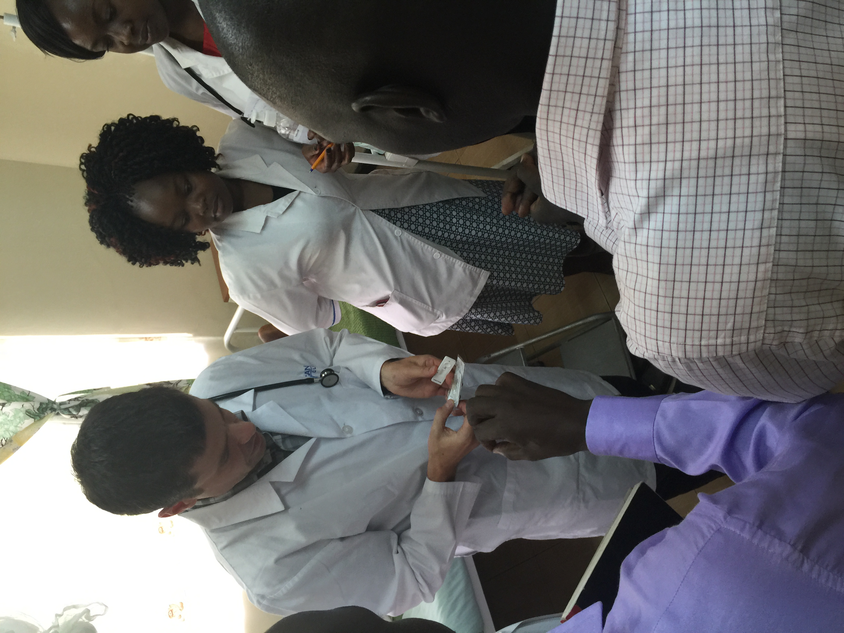 Dr. Hawkes with a patient at the Field-Marsham Medical Centre