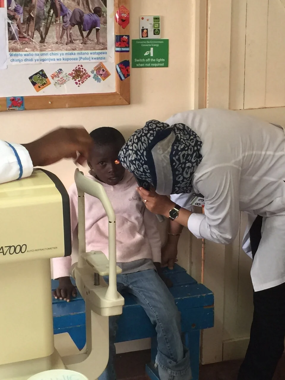 Dr. Sidiqa Rajani with the young boy