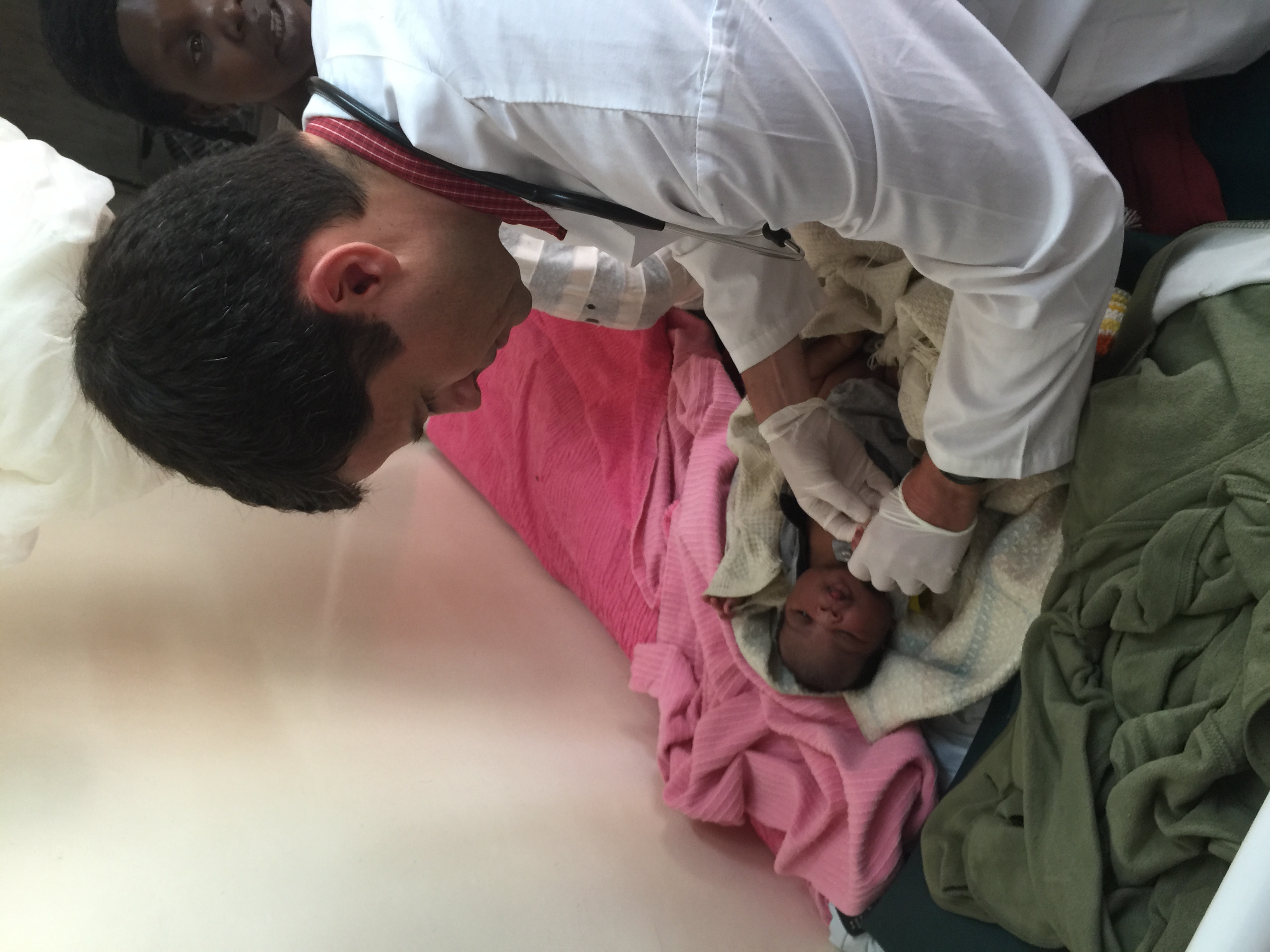 Dr. Hawkes performing a neonatal examination