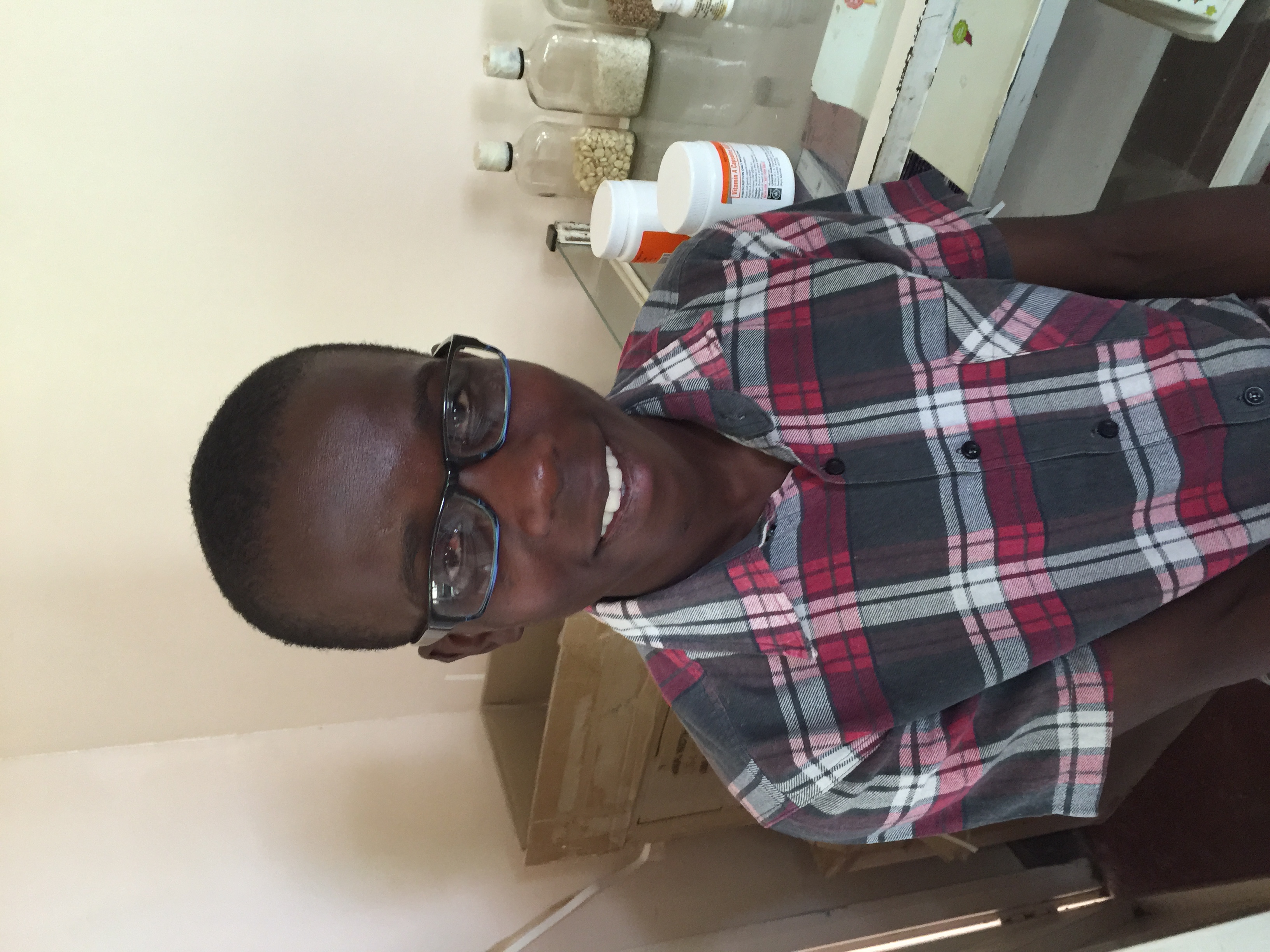 Boy receiving prescription glasses