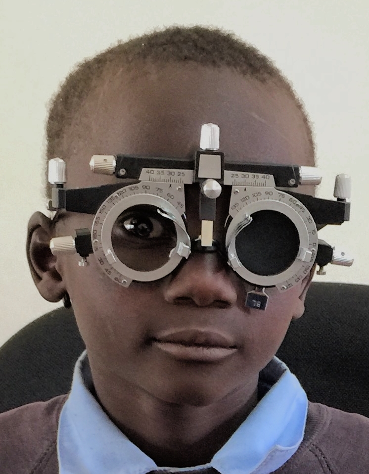 A little boy being measured for prescription glasses. We screened 50 children during a school vision clinic and identified 4 that required glasses. Naweza will provide the glasses for the children. Lewa and Naweza will continue to do the school screenings and will partner in funding any eye wear required. 