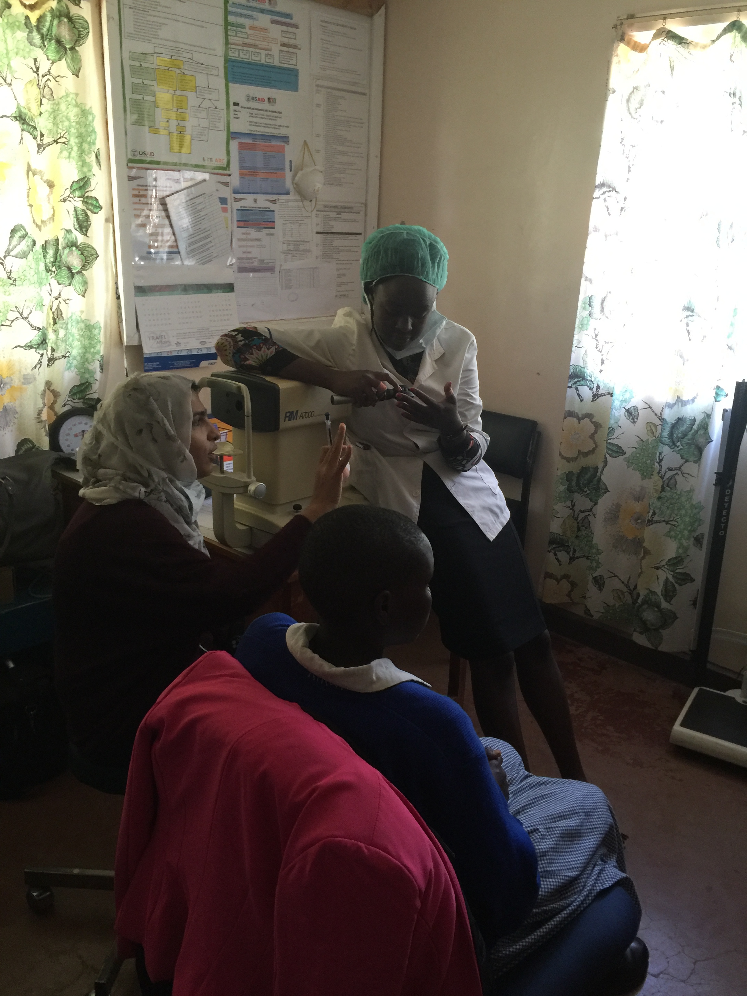 Jemimah and Sidiqa doing an eye exam
