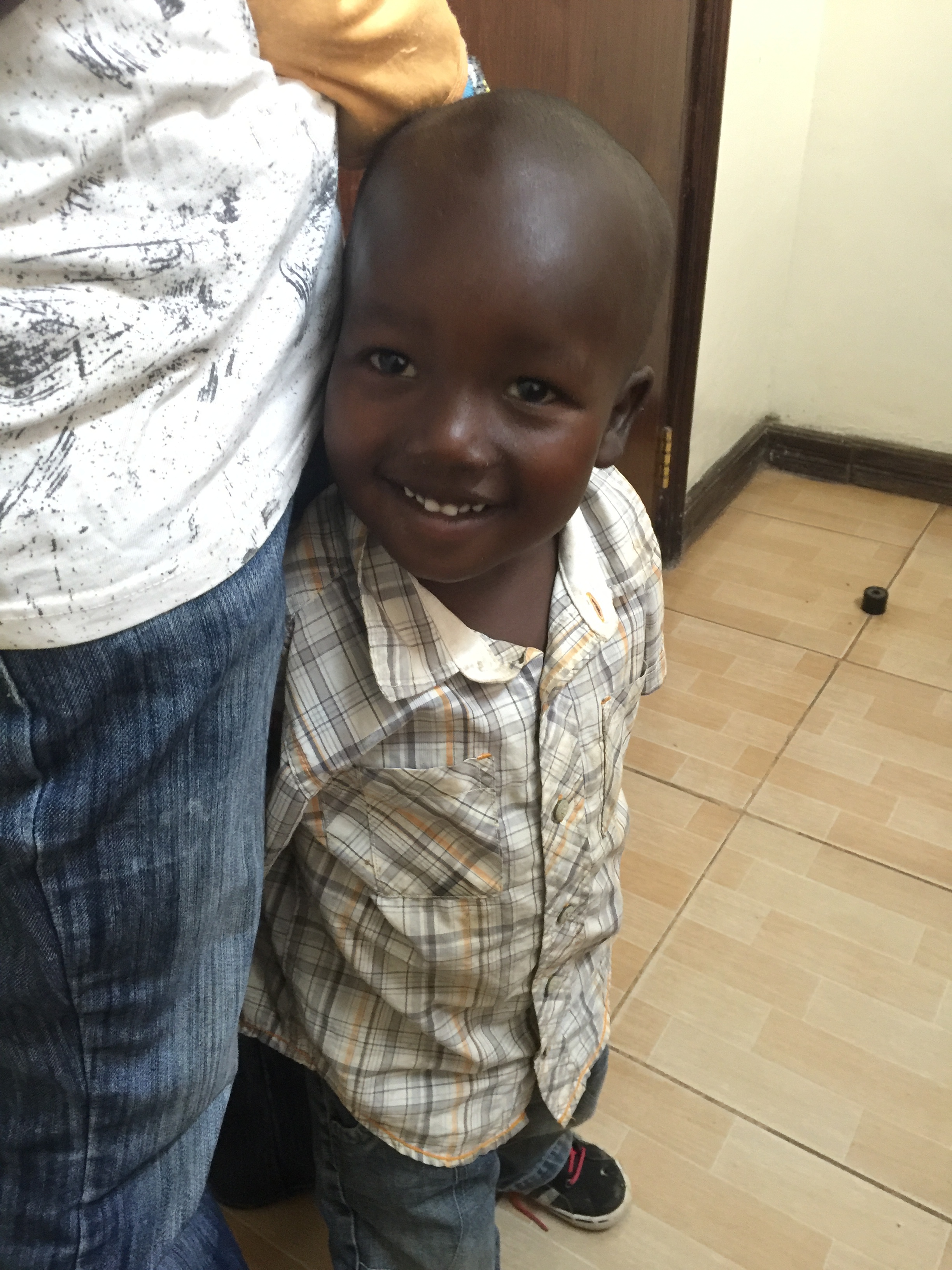 A young patient smiling after care. Another family including a mother and her infant were treated for dehydration. 