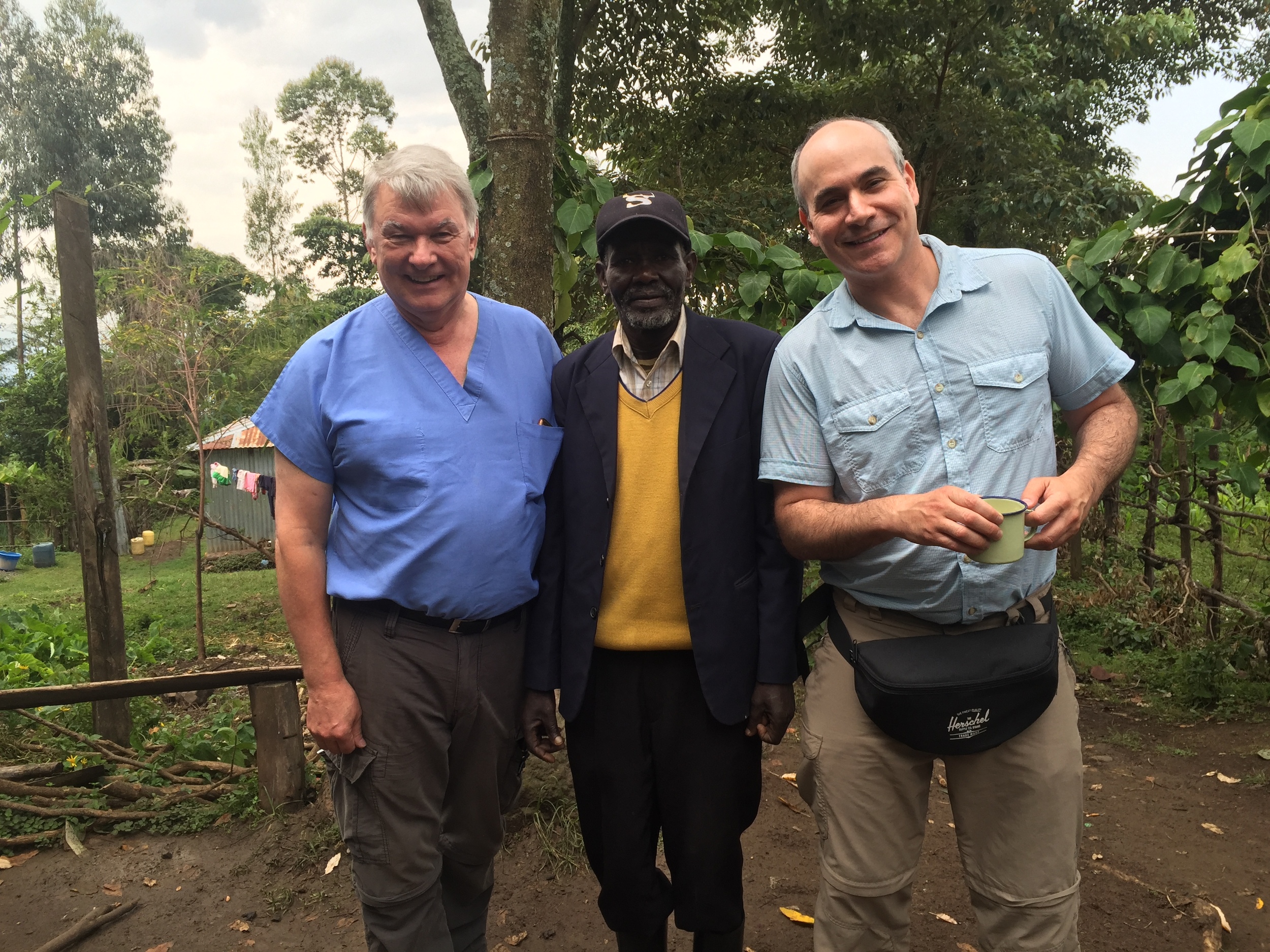 Dr. Ed and Dr. Paul with the village chief whose house we are using to see patients. 