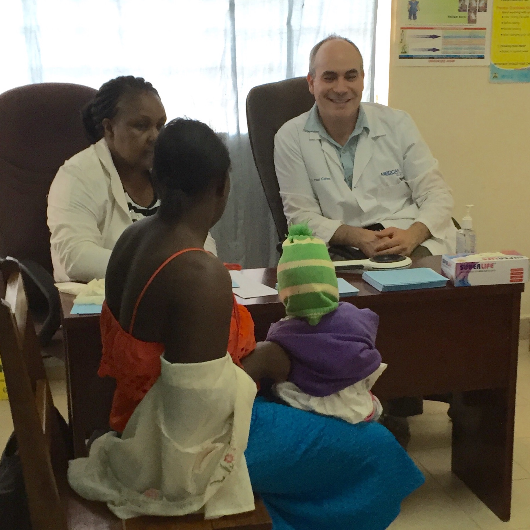 Dr. Paul and Faith seeing a patient at the outreach. 