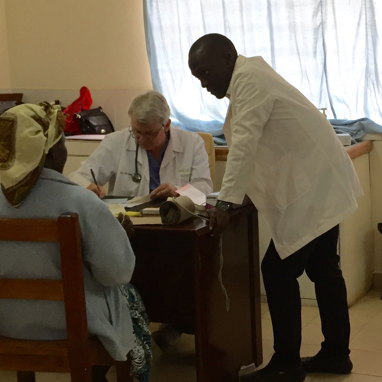 Dr. Ed and Hagai seeing a patient at the clinic