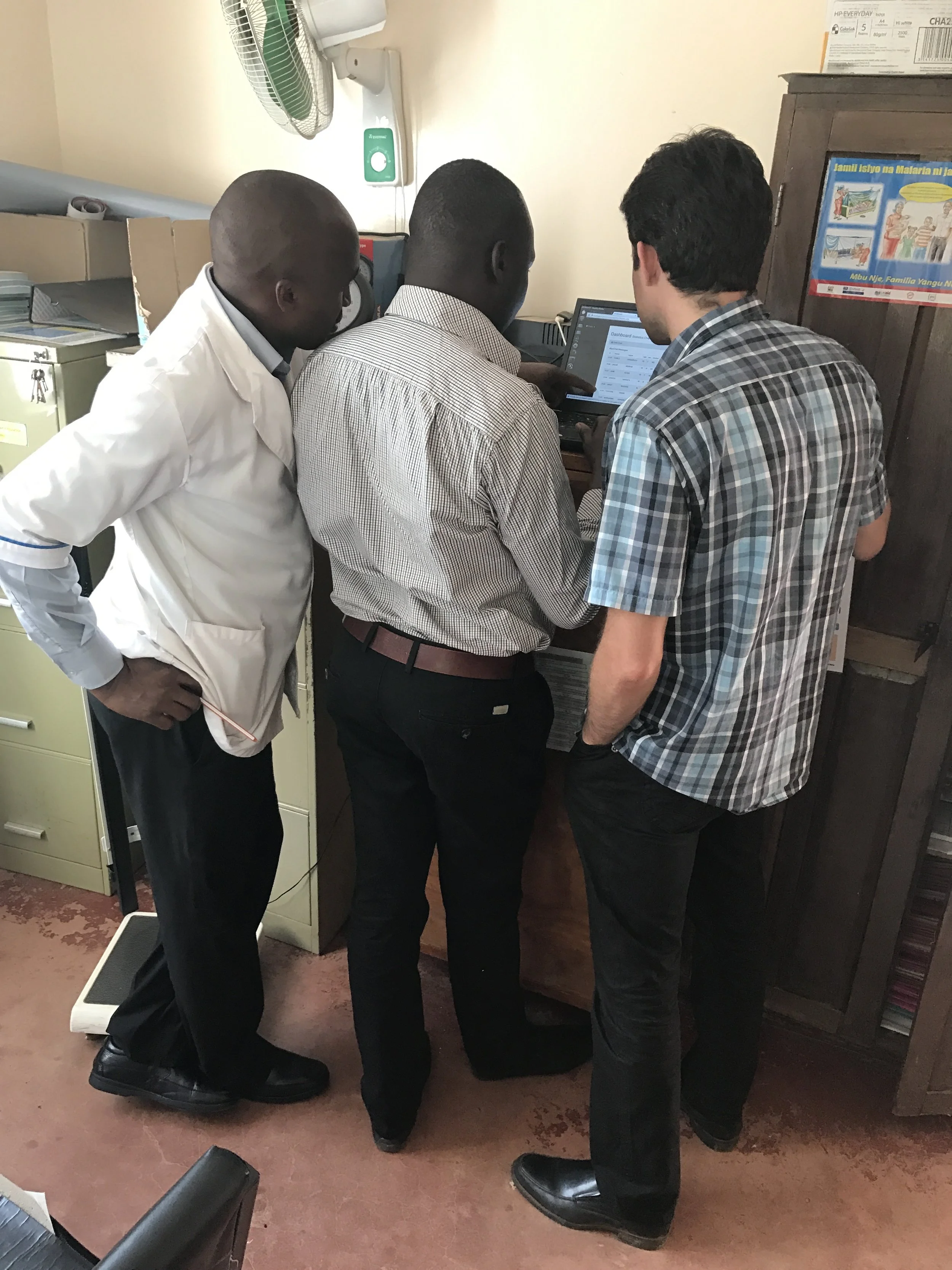 Reviewing the Chronic Disease data on the computer provided by Naweza. The Community Health Workers have screened over 3,000 people over the age of 40 to identify those at risk of a cardiovascular event in the next 10 years,