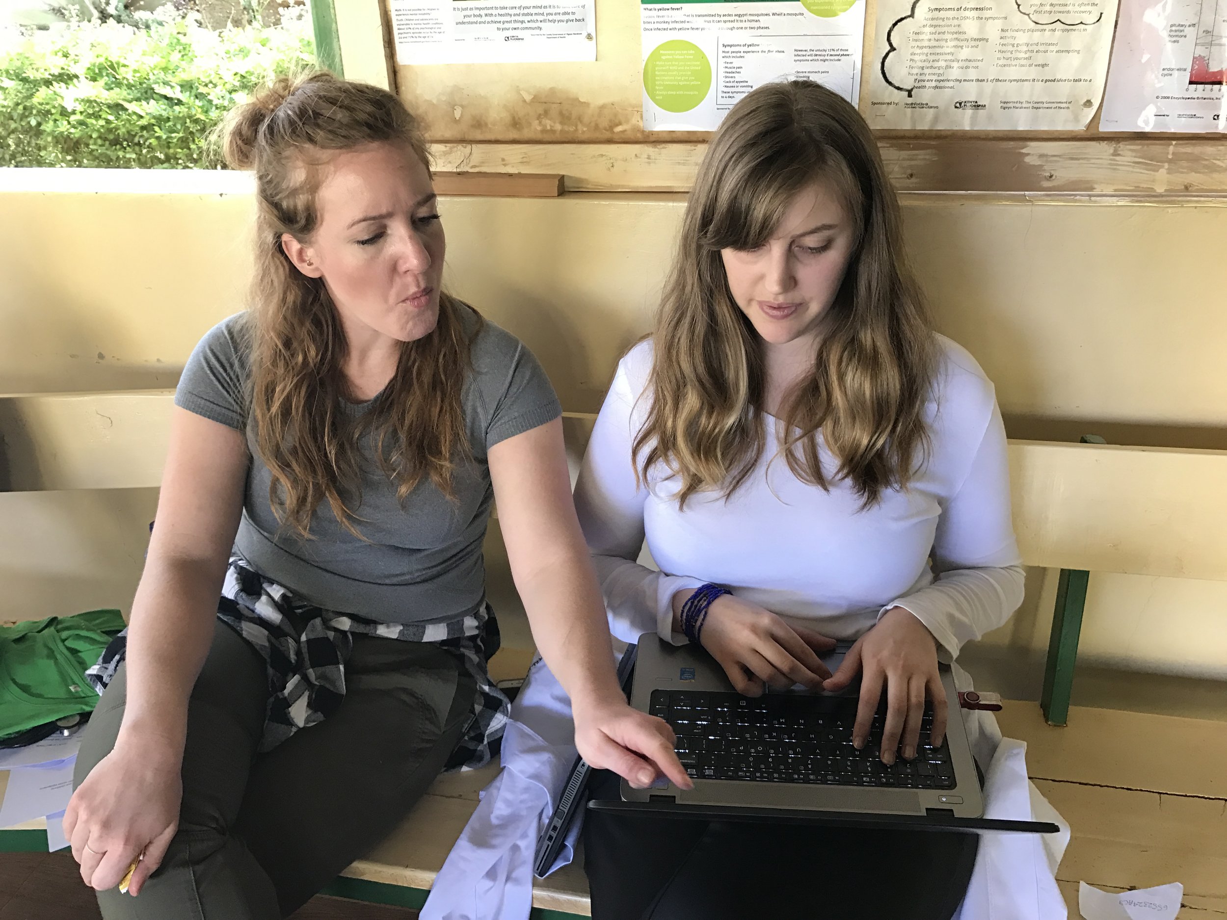 Vanessa and Jen working on a presentation together.