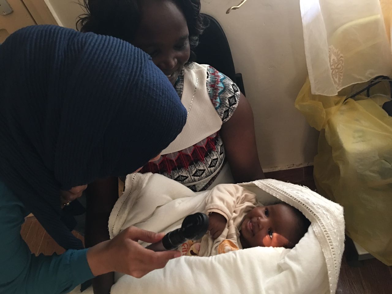 Dr. Sidiqa with a young patient.