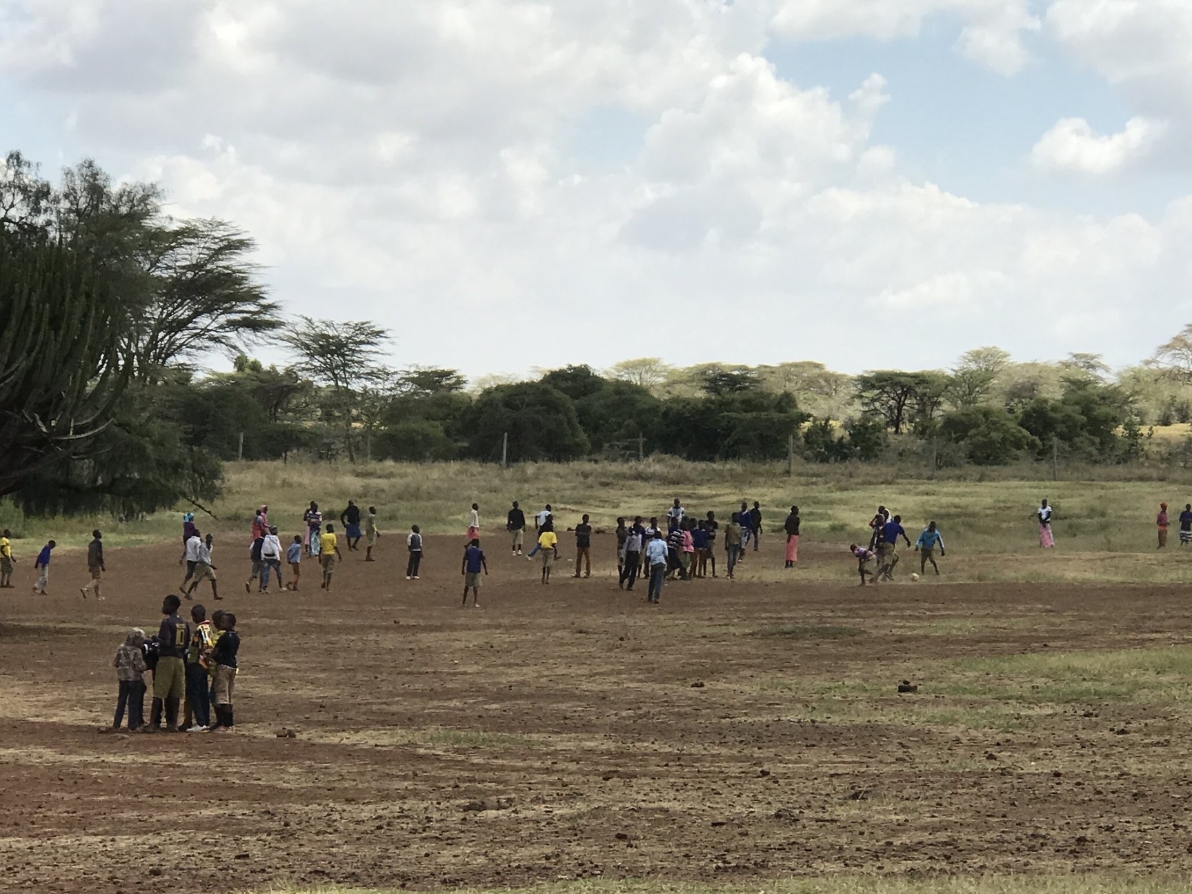  Children playing soccer as we arrive at the outreach. 