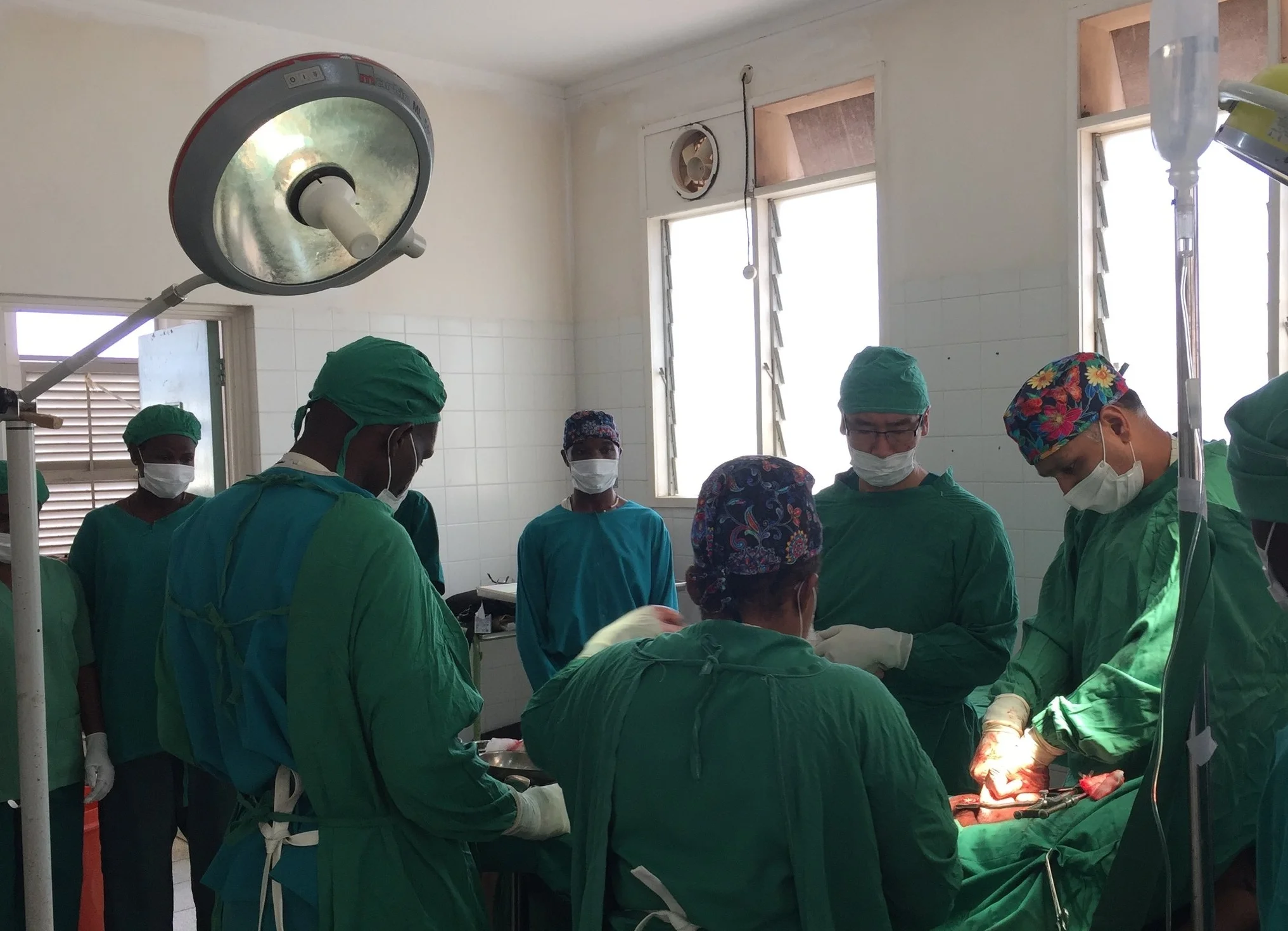 Dr. Rajiv performing a prostate removal surgery and providing education and training to the hospital staff.