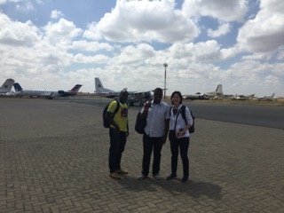 Dent, Bernard and Dr. Sue Wong walk to the airplane
