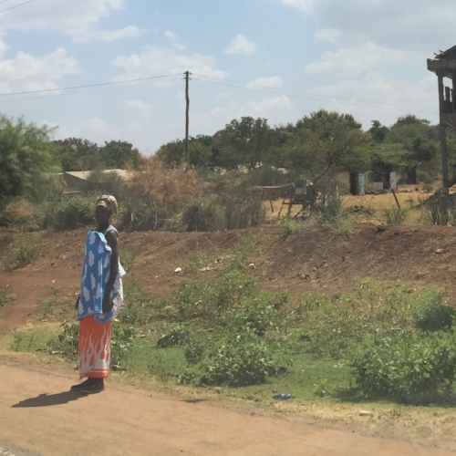  Woman standing by road en route to Isiolo Hospital 