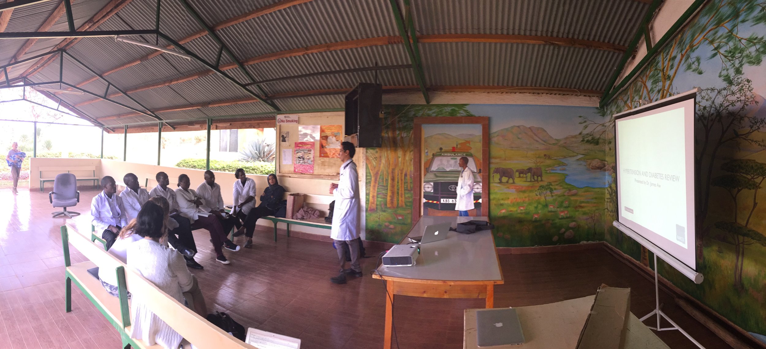 Dr. James starts off the CME sessions in a open-air lounge area on the grounds of the Lewa clinic
