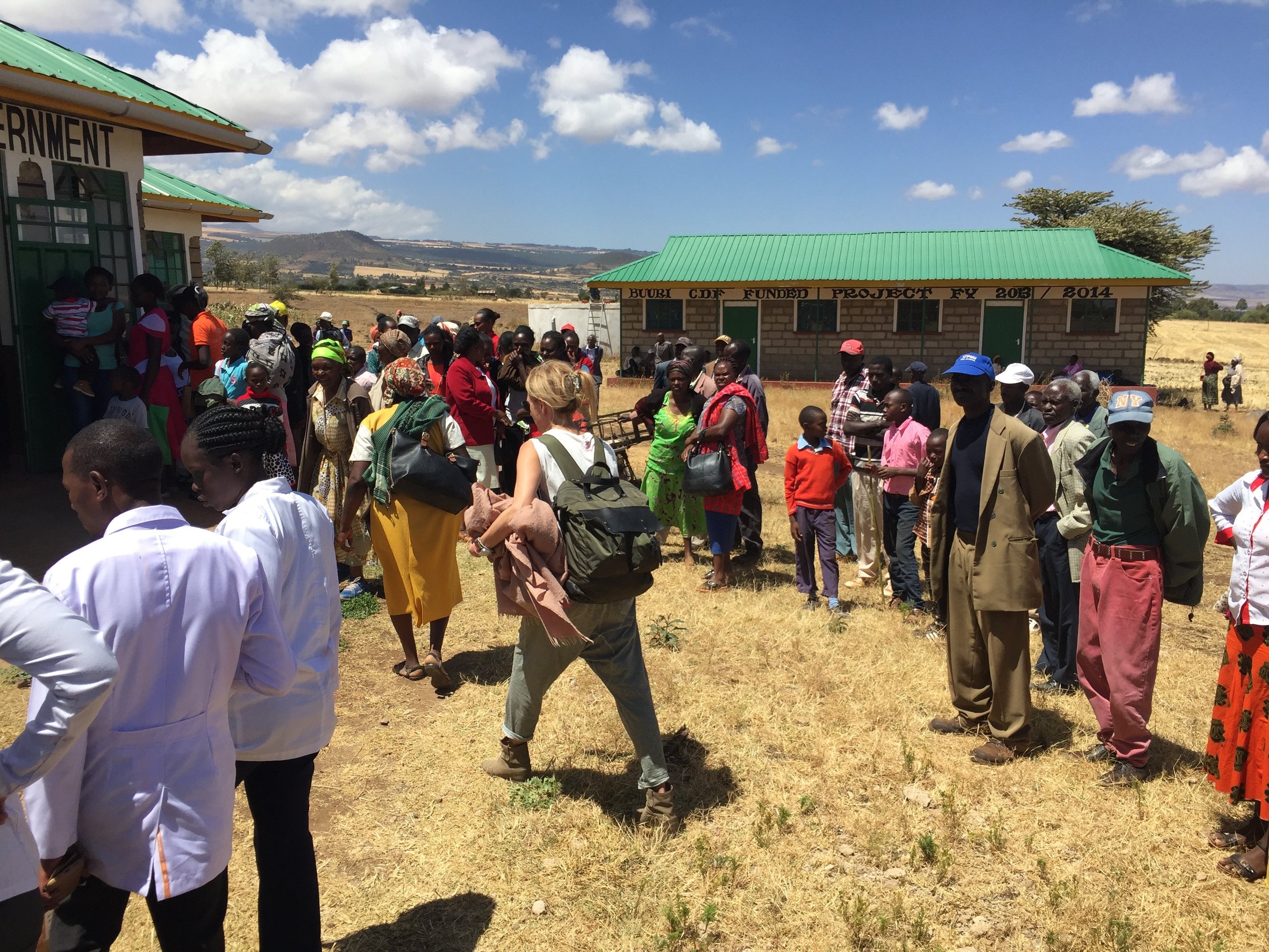 Stacy Francis and the Lewa nurses (at bottom left) upon arrival at the outreach location. Patients wait to be introduced to this outreach's clinicians
