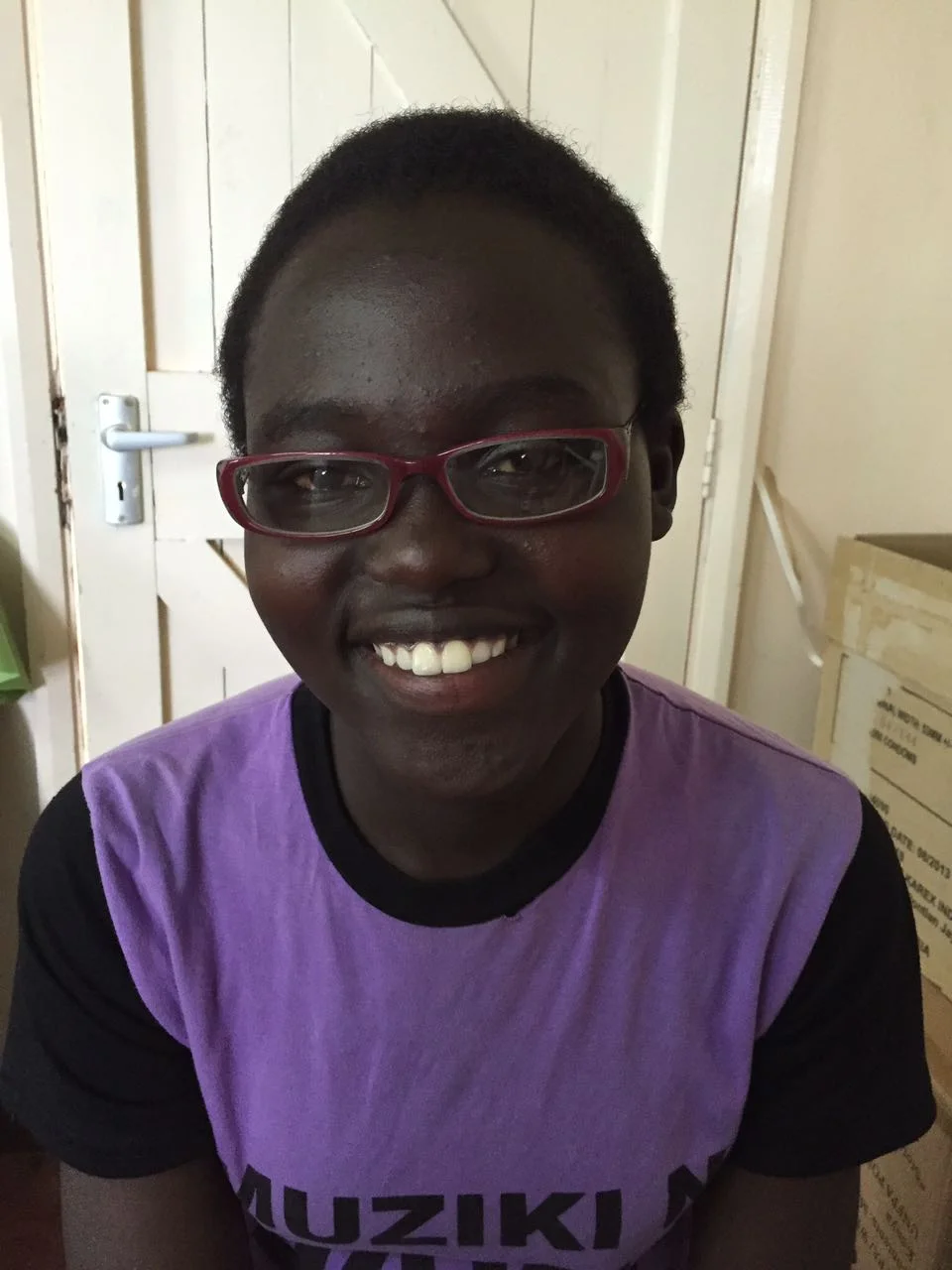 Doesn't she look smart? The spectacles will not only help the children see better, but also protect their eyes from all the dust