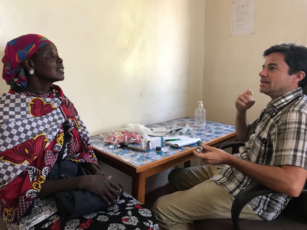 Dr. Michael providing counselling on the proper use of an inhaler