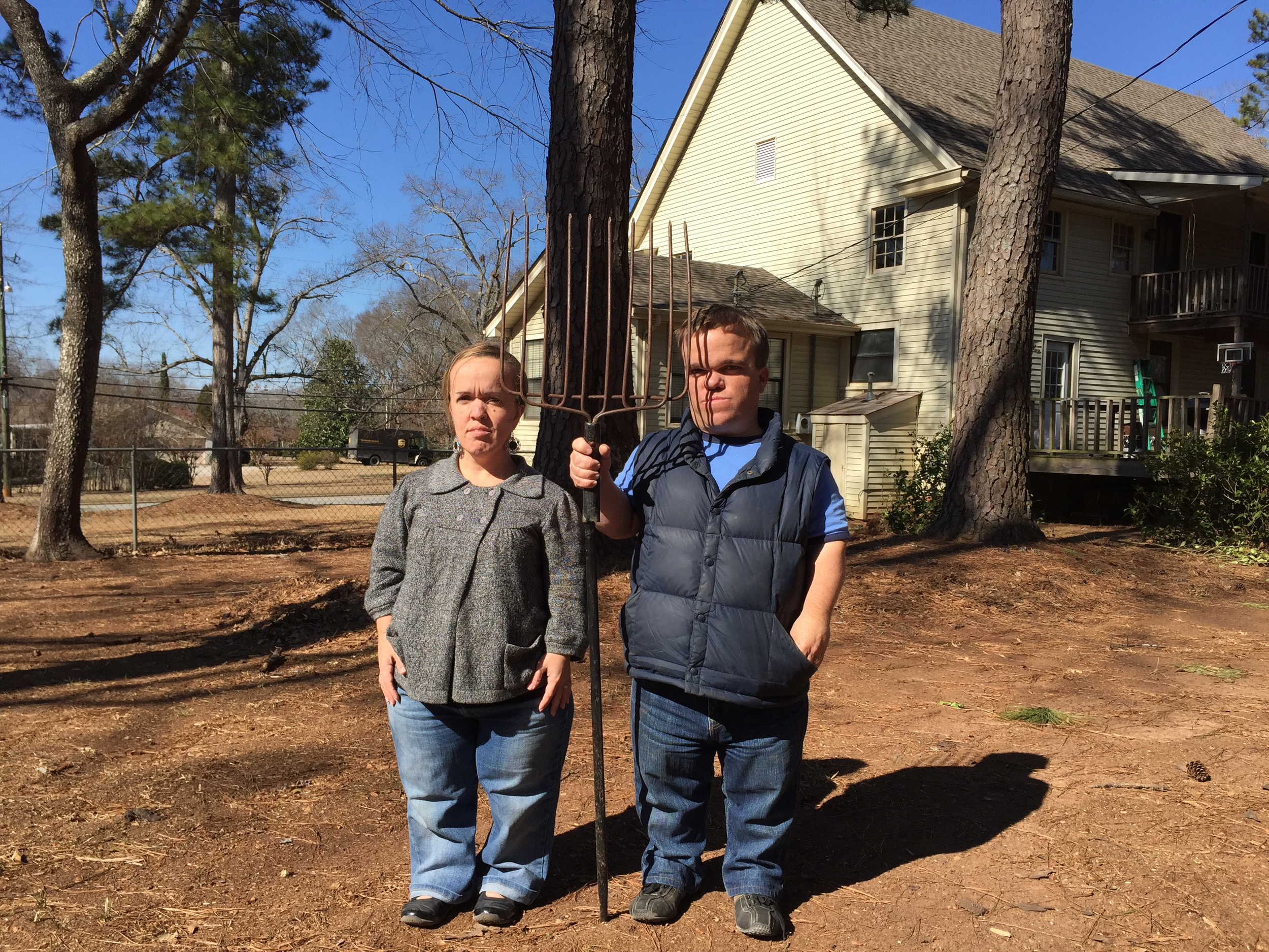   Trent and Amber with pitchfork  